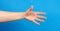 Outstretched hand of man, open hand, part of the body on a blue background