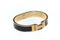 An oval ellipse stainless steel latch locking black gold bracelet bangle