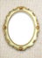 Oval golden color picture frame