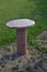 Oval granite table on a lawn
