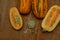 Oval pumpkin lies on a wooden table