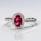 a oval ruby ring set in 18k white gold generative AI