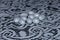 Oval silver candies on a lace tablecloth