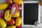 Oval tomatoes and half a tomato on a dark wooden background