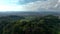 OVARO MIONE, ITALY - APRIL, 2023: Aerial drone view of a valley in the morning with clouds. Small mauntain village Mione