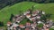 OVARO MIONE, ITALY - APRIL, 2023: Aerial drone view of a valley in the morning with clouds. Small mauntain village Mione