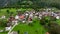 OVARO MIONE, ITALY - APRIL, 2023: Aerial drone view of a valley in the morning with clouds. Small mauntain village Mione