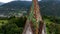 OVARO MIONE, ITALY - APRIL, 2023: Aerial drone view of a valley in the morning with clouds. Small mauntain village Mione