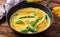 Oven baked omelette with flowers zucchini in pan