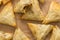 Oven baked phyllo pastry samosas filled with spicy meat - top view photo of  appetizer snacks