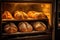 oven filled with baking artisan bread loaves