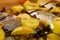 oven grilled sea bream fish with delicious curry sauce served on baking tray, baked potatoes with champignon mushrooms, spices,