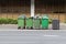 Over filled Wheelie bins, waste containers full of trash on foot