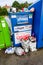 Over flowing charity collection banks used as litter bins