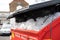 Over flowing industrial waste bin seen full of used plastic bags.