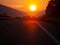 Over the hill. Motorway sunset, with holidaymaker cars returning from vacation, holiday. Homeward bound. Genuine image