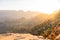 Over The Rim Of The Grand Canyon The Sun Rises Sending Shafts Of Light Deep Into The Canyon