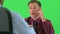 over the shoulder of two businessmen talking on greenscreen