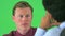 over the shoulder of two businessmen talking on greenscreen