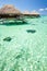 Over water bungalow with steps into green lagoon