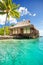 Over water bungalow with steps into lagoon