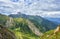 Overcast clouds over mountain ranges. The state of nature before rain. Eastern Sayan. Russia