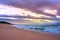 Overcast cloudy sunrise over a rough Indian Ocean from a view point on a beach in Port Shepstone