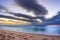 Overcast cloudy sunrise over a rough Indian Ocean from a view point on a beach in Port Shepstone