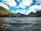 Overcast day at Dove Lake in Northern Tasmania with some blue sky in between the clouds