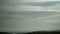 Overcast Irish sky over green hills, timelapse video. Fast flight of clouds in the sky