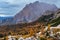 Overcast morning autumn alpine Dolomites mountain scene. Peaceful Valparola Path view, Belluno, Italy