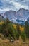 Overcast morning autumn alpine Dolomites mountain scene. Peaceful view near Valparola Path, Belluno, Italy