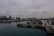 Overcast skies above empty boat docks on calm water