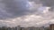 Overcast sky with gray clouds over skyscrapers and apartment buildings