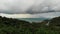 Overcast sky over tropical island. Gray cloudy sky, green palms on Koh Samui during wet season in Thailand. Drone view. Flying