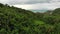 Overcast sky over tropical island. Gray cloudy sky, green palms on Koh Samui during wet season in Thailand. Drone view. Flying