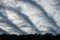 Overcast sky with a recurring stripe pattern clouds