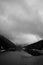 Overcast sky and thick fog rolls over coniferous trees above the Sance dam near the town of Ostravice, Czech Republic