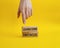 Overcome obstacles symbol. Concept words Overcome obstacles on wooden blocks. Businessman hand. Beautiful yellow background.