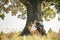 Overcoming the fear of heights. Happy children on countryside. Climbing trees children. Little boy and girl climbing