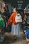 Overconsumption in Fashion Industry. fast fashion. Young Beautiful woman chooses handbags in the shop. Kropivnitskiy, Ukraine,