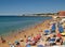 Overcrowded Atlantic beach in Armacao de Pera, Algarve - Portugal