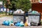 overfilled public trash bins at summer day in Bishkek, Kyrgyzstan