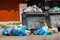 overfilled public trash bins at summer day in Bishkek, Kyrgyzstan