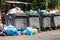 overfilled public trash bins at summer day in Bishkek, Kyrgyzstan