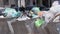 overfilled public trash bins at summer day in large city center, close-up slow motion