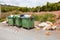 Overflowing bins next to Orange Orchard, Valencia region, Spain