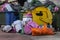 Overflowing garbage containers and trash bags lying on sidewalk