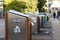 Overflowing trash bins and litter on the floor in the urban street