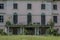 overgrown facade from a castle with balcony